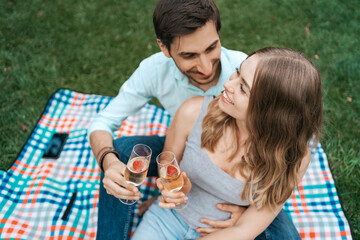 Summer holidays, people, romance, dating concept, couple drinking sparkling wine while enjoying time together at home on the backyard
