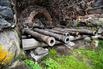 Fototapeta premium ancient fortress cannons made of cast iron for the defense of an ancient fortress
