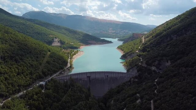 Italy, August 2020 - aerial and panoramic view of Lake Fiastra with its dam taken by the drone. The lake is located in the province of Macerata in the Marche region
