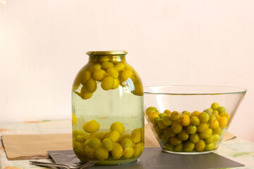 preparation for storage of yellow plum berries, yellow plum compote in a glass jar