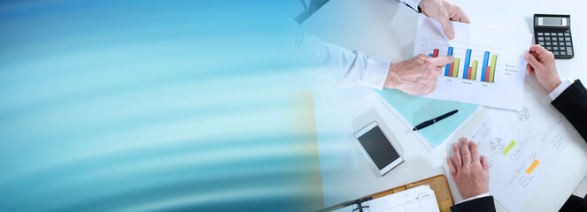 Businesspeople having a discussion about financial report; panoramic banner