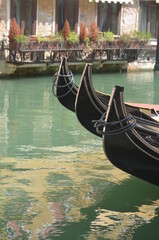 
Venetian foreshortening with resting gondolas in a typical canal