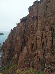 High cliffs and waterfalls on the Barents sea coast of the Arctic ocean