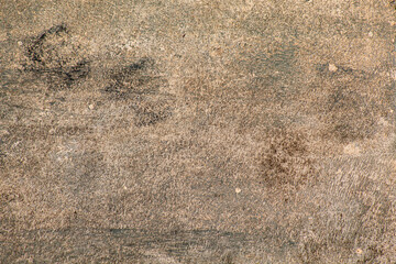 Chão de concreto marrom criando uma textura  acimentada