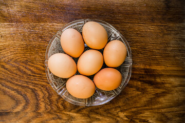 Organic brown eggs on a wooden table. Easter concept.