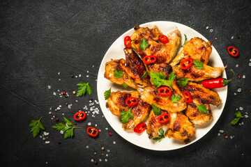 Grilled chicken wings at black.