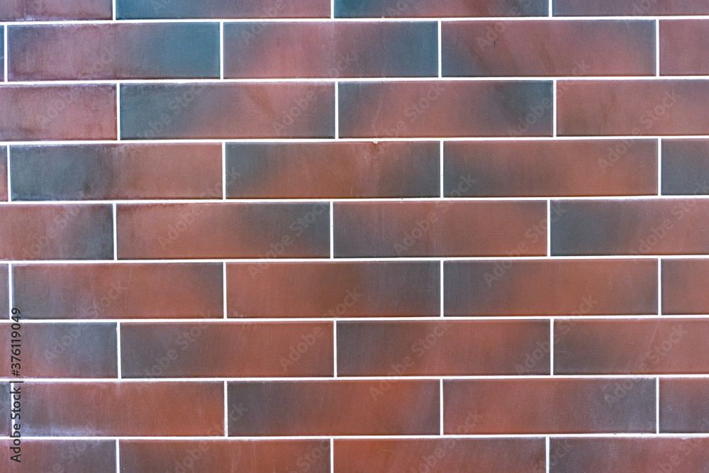 Wall mural red brick wall. texture of dark brown and red brick with white filling