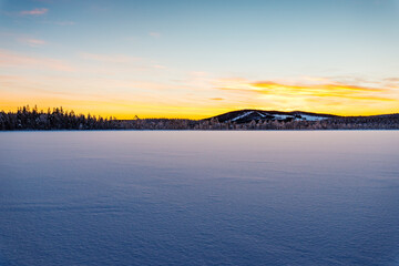 Winter landscape during dawn in Swedish Lapland, near Jokkmokk, Sweden