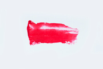 Red colored brush stroke paiting over isolated background,red lipstick smudge