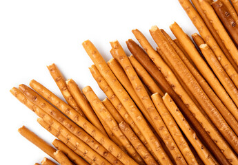 Creative layout made of crackers sticks on the white background. Food concept. Edible snack dry sticks with salt on white background. Straws, sticks crackers.