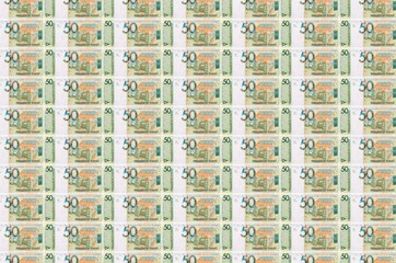 50 Belorussian rubles bills printed in money production conveyor. Collage of many bills. Concept of...