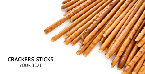 Creative layout made of crackers sticks on the white background. Food concept. Edible snack dry sticks with salt on white background. Straws, sticks crackers.