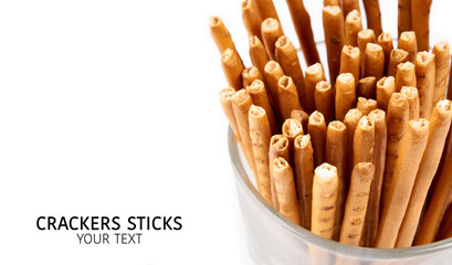 Creative layout made of crackers sticks on the white background. Food concept. Edible snack dry sticks with salt on white background. Straws, sticks crackers.