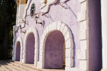 beautiful building with arches and lamps