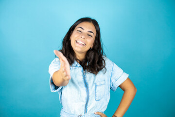 Fototapeta premium smiling friendly offering handshake as greeting and welcoming