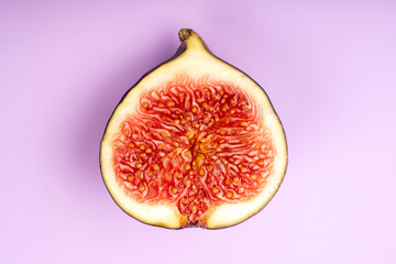 Figs isolated on black background. Half a fig. Healthy food concept.