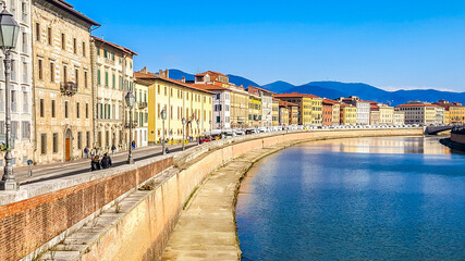 Naklejka na ściany i meble Embankment of Arno river in Pisa, Italy.