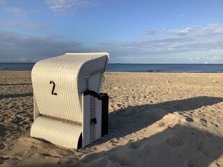 Single wicker beach chair number 2 on sandy beach of the Baltic Sea at Usedom, Mecklenburg...
