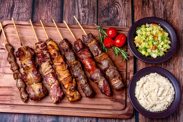 Kebab - Grilled meat on a cutting board, with flour and vinaigrette salad