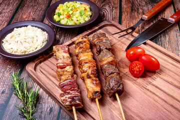Kebab - Grilled meat on a cutting board, with flour and vinaigrette salad