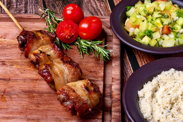 Kebab - Grilled meat on a cutting board, with flour and vinaigrette salad