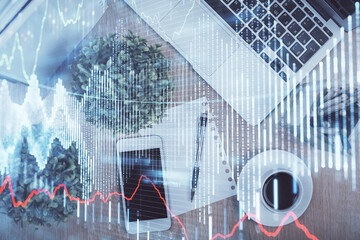 Multi exposure of financial chart hologram over desktop with phone. Top view. Mobile trade platform concept.