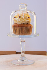 Carrot cupcakes with mascarpone cream and grated walnuts
