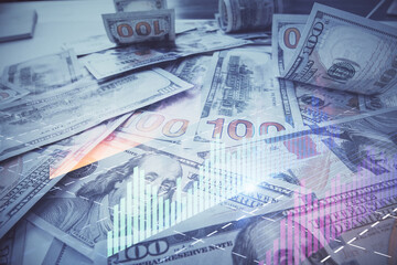 Multi exposure of forex chart drawing over us dollars bill background. Concept of financial success markets.
