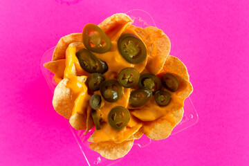Nachos with Peppers on Bright Pink Background