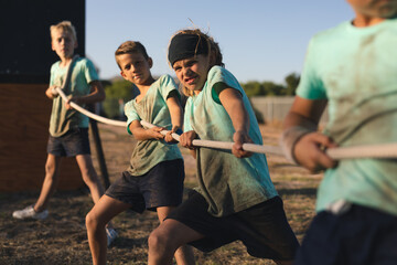 Children pulling rope at boot camp