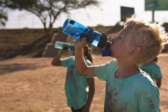 Group of boys drinking water at a boot camp