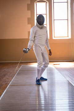 Woman wearing fencing outfit 