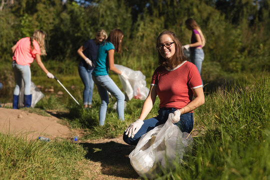 Volunteers cleaning up river in the countryside