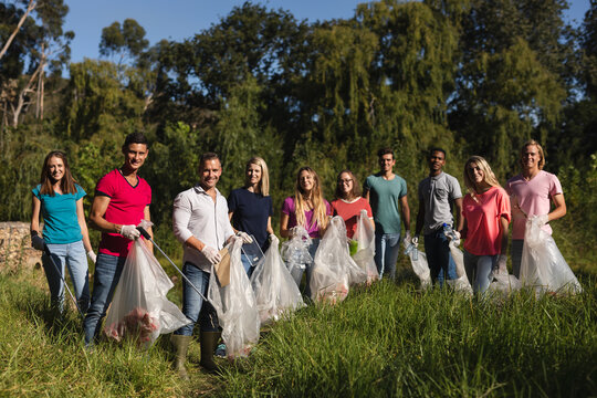 Volunteers cleaning up river in the countryside