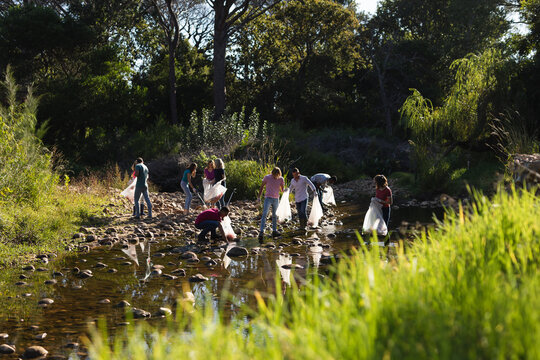 Volunteers cleaning up river in the countryside