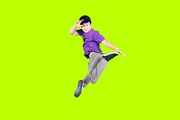 Male dancer jumping while performing break dance
