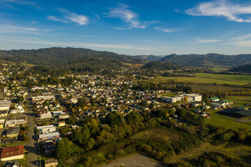 Aerial of small town Myrtle Point in Southern Oregon and green fields