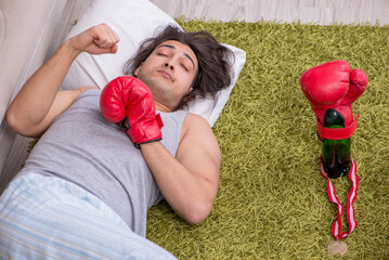 Male ex-champion boxer suffering from alcoholism at home