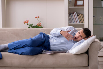 Young male employee working from the house