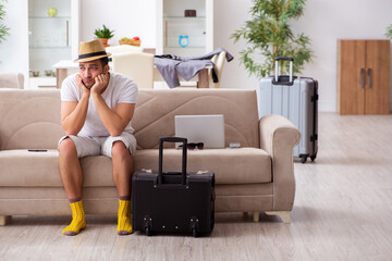 Young man preparing for departure at home