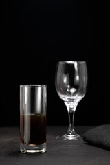 glass of coffee splash on dark background, shot of coffee