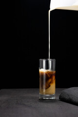 glass of coffee liqueur on dark background