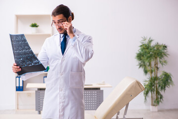 Young male doctor radiologist working in the clinic