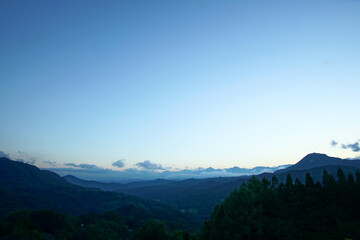 Fototapeta na wymiar Blue sky above high mountain landscape in daytime, Japanese alps, Hakuba, Japan