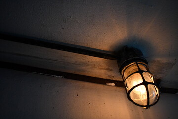 Dim lamp in old bunker.
