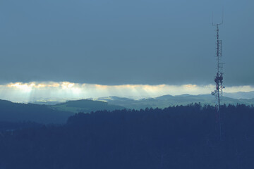 View from the lookout tower Breitenstein in Kirchschlag towards the sent-towers during storms and rain