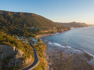 Fototapeta premium Morning view of Coalcliff Beach with clear sky.