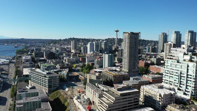 Drone footage of the Belltown, Pike Place, Seattle downtown, waterfront, piers, empty Alaskan Way with skyscrapers, during the pandemic