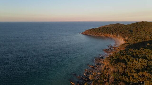 Sunset over the beach and waves - Sunshine Coast Noosa National Park Queensland Australia - Aerial