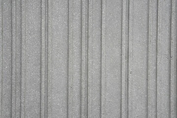 Grey cement texture background with grooved vertical lines for unique texture